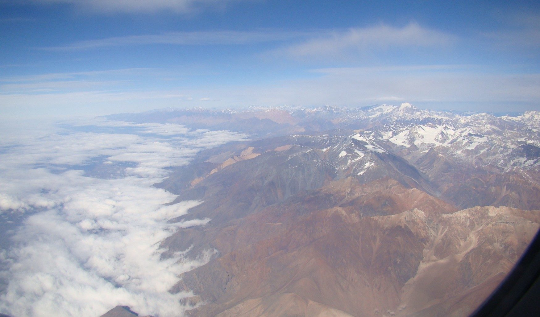 a high angle view of mountains and clouds