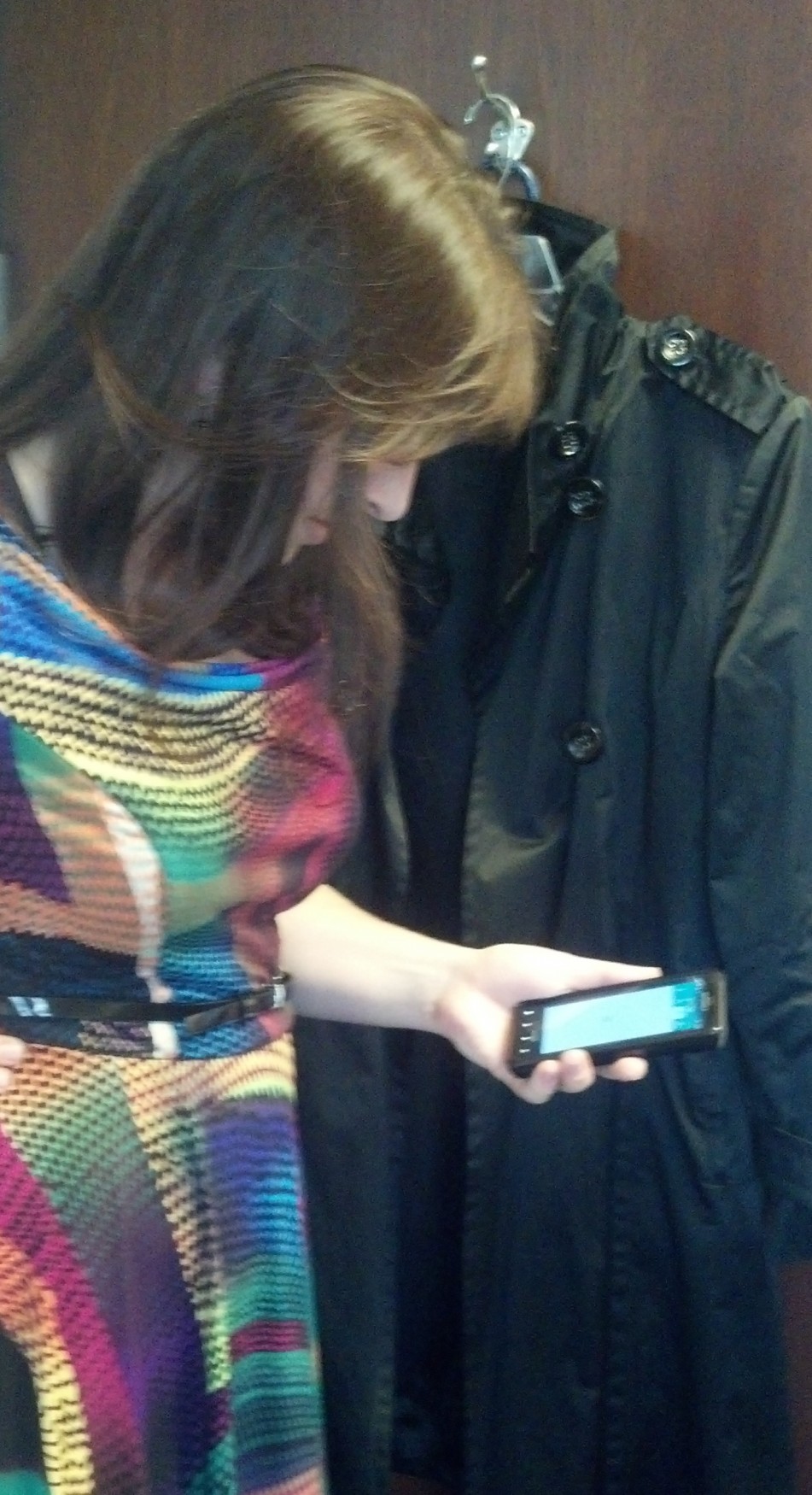 a woman looking at a cell phone