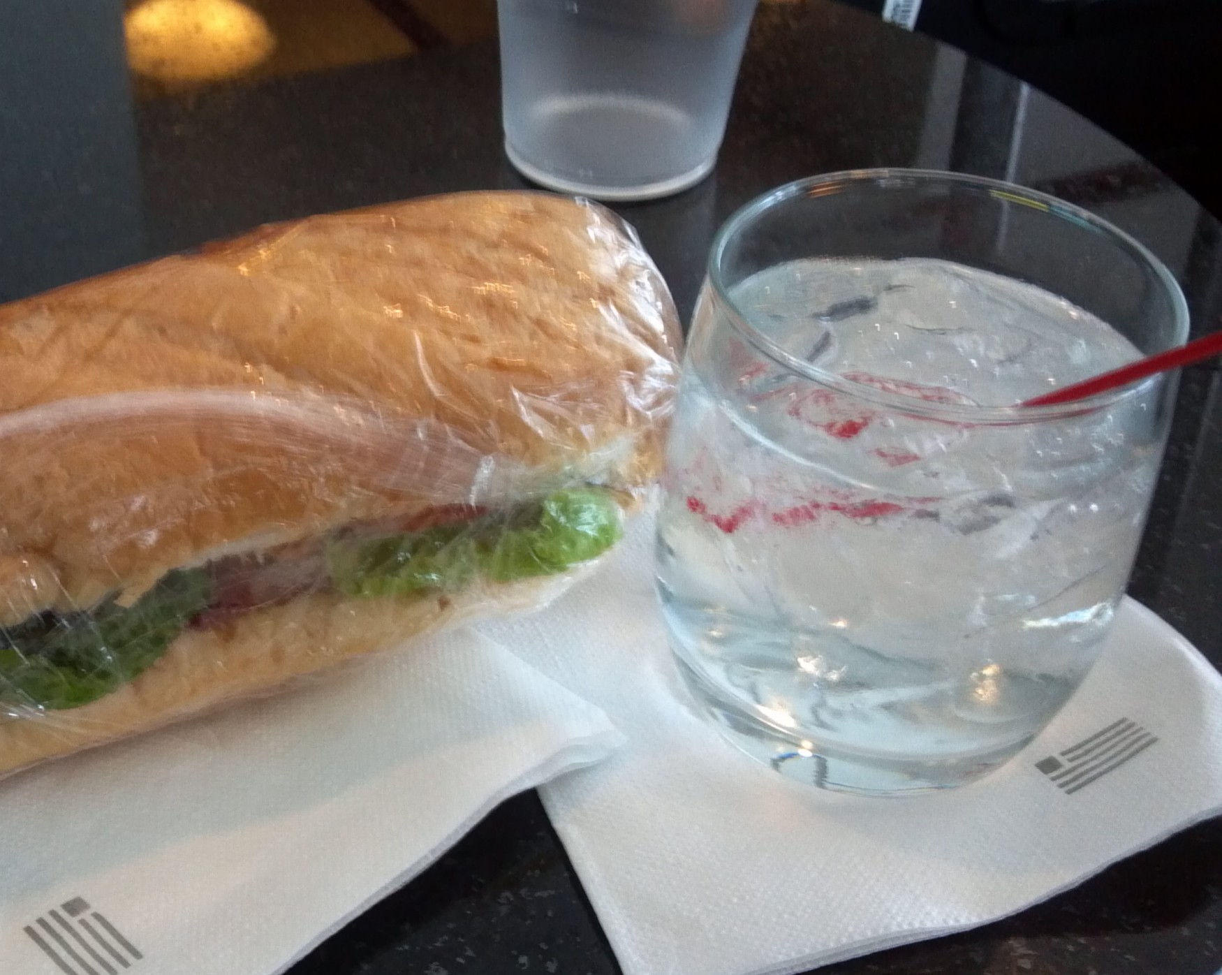 a sandwich and a glass of water