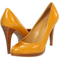 a pair of yellow high heeled shoes