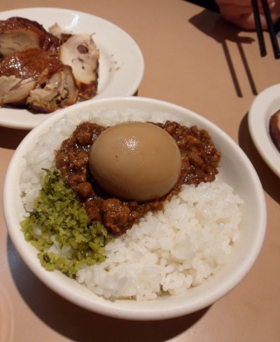 a bowl of rice with a boiled egg