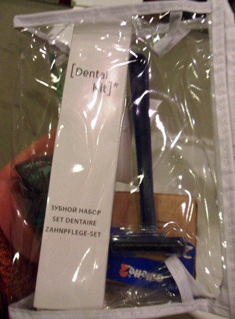 a plastic bag with a razor and a white label