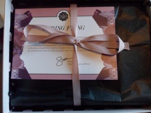 a gift box with a pink ribbon