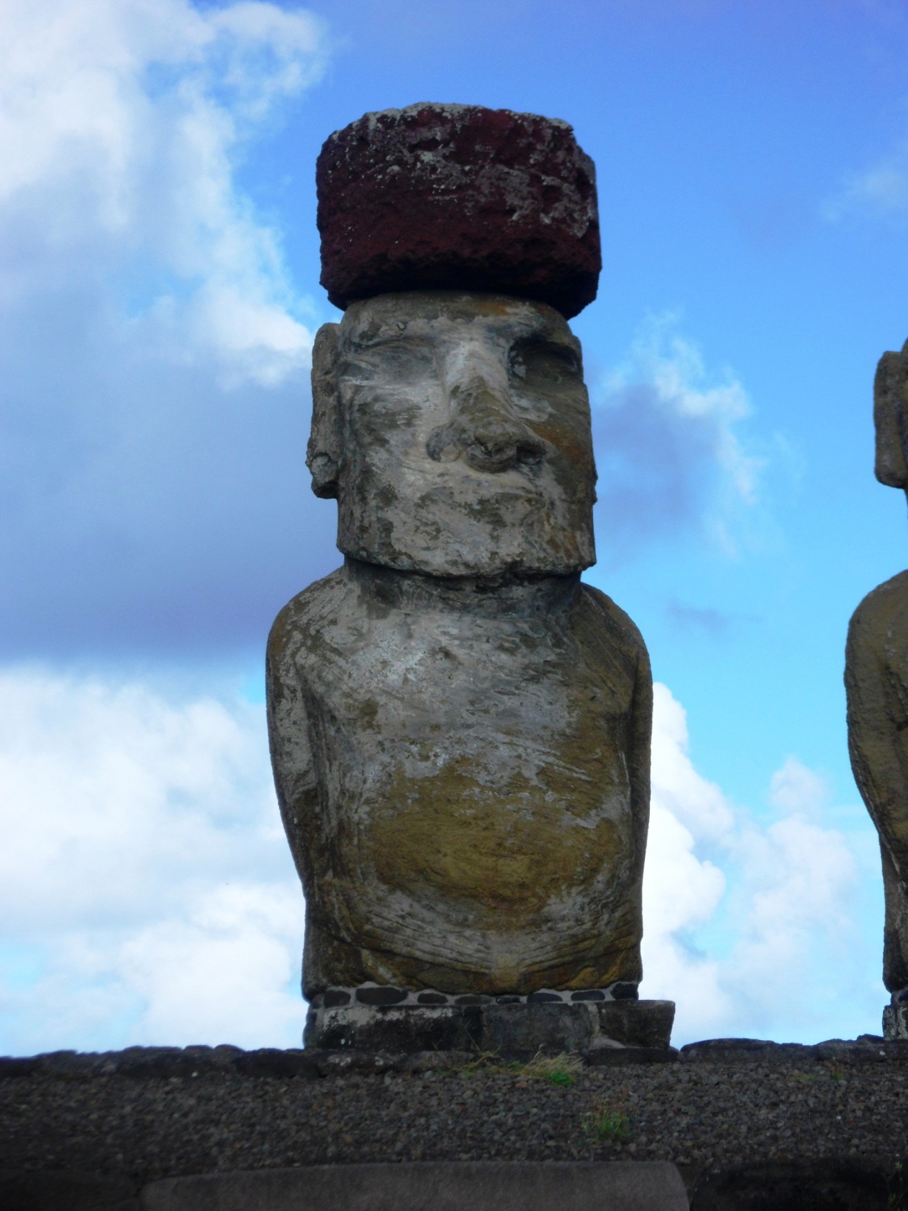 a stone statues with a stone head on top