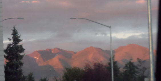 a street light in front of mountains