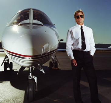 a man standing next to a plane