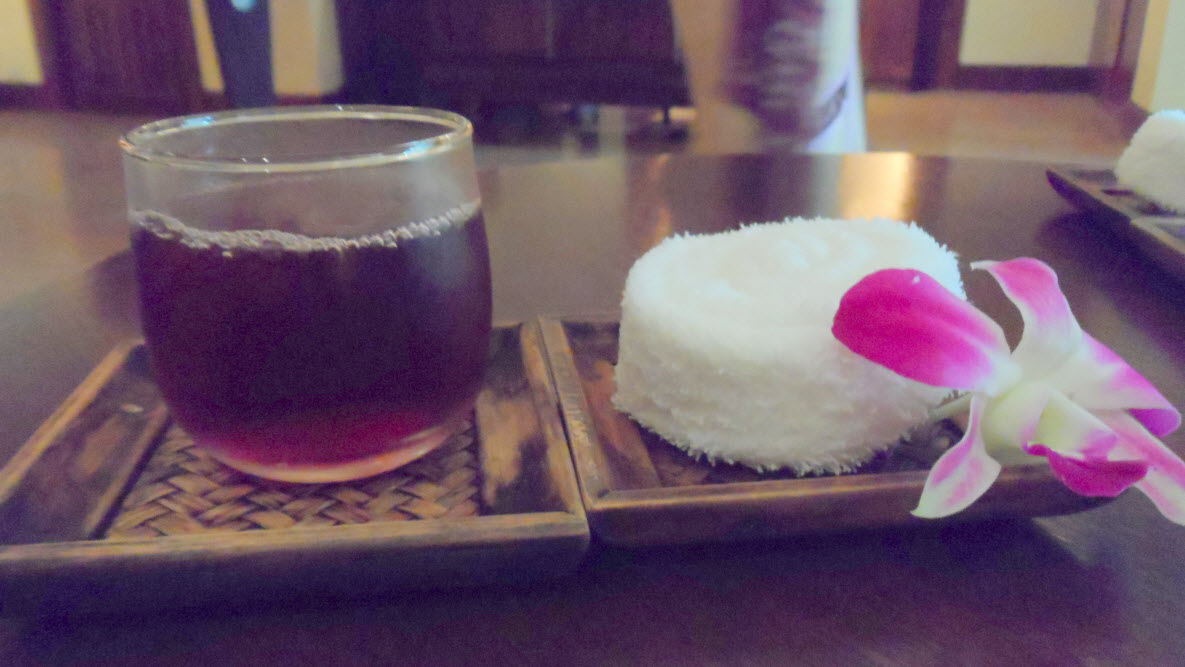 a cup of tea and a dessert on a tray