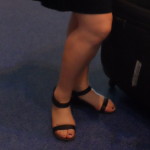 a person's legs with sandals