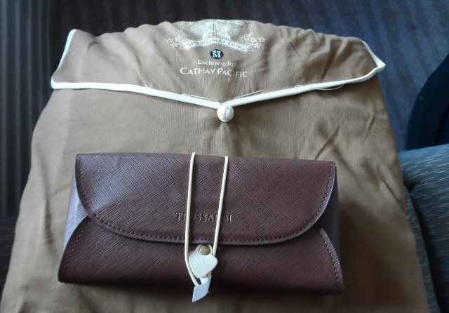 a brown wallet on a brown bag