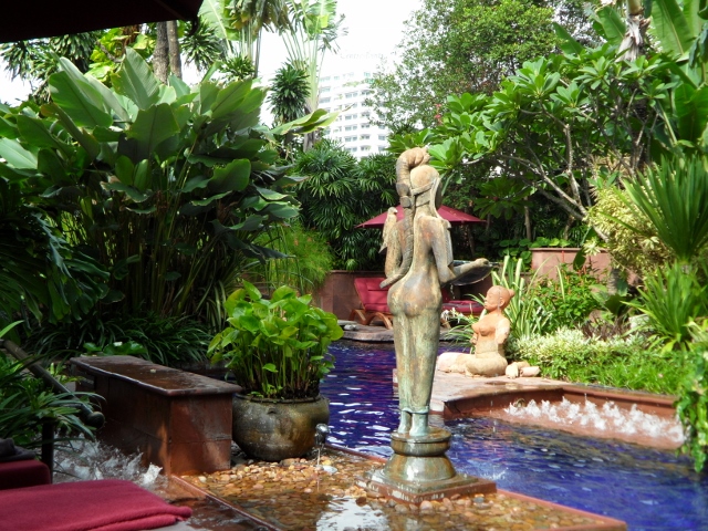 a statue in a pool