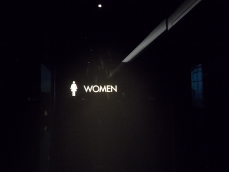 a sign with a woman and a man