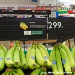 bananas on a shelf in a grocery store