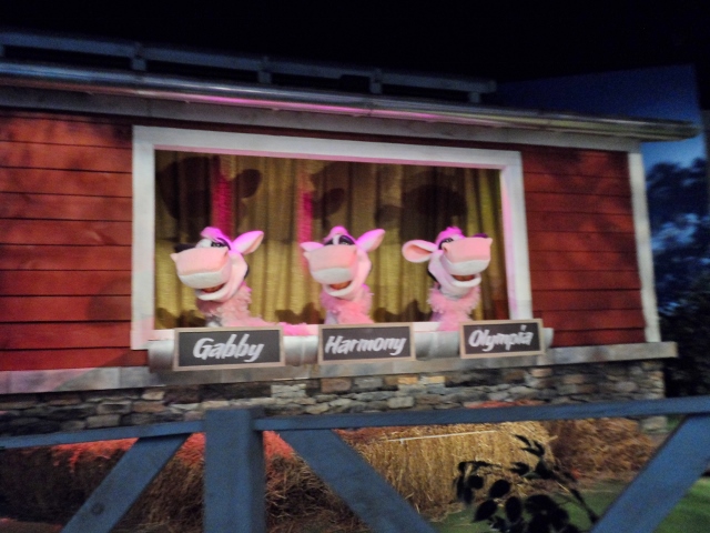 a group of pink animals in a window