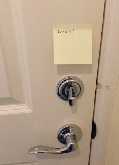 a door handle with a post-it note on it