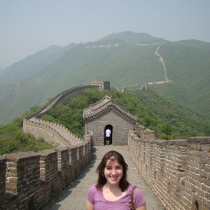 a woman standing on a bridge