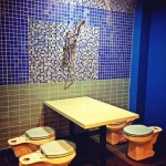 a bathroom with a table and toilet