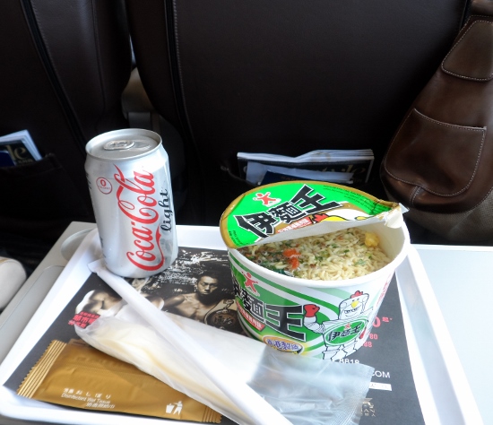 a tray with food and a soda on it