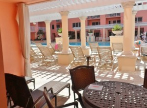 a patio with chairs and a table