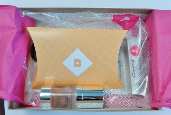a box with a small box of cosmetics