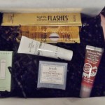 a box of cosmetics and a tube of cream