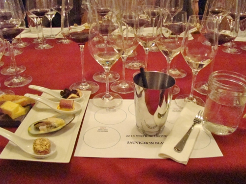a table with many wine glasses