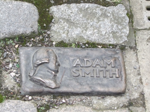 a stone plaque with a man's head engraved on it
