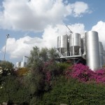 a large silver tanks on a hill