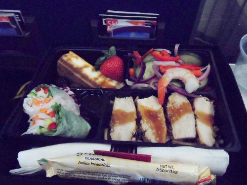 a tray of food in a black container