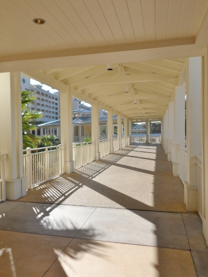 long white walkway with white pillars