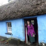 a woman in a purple coat in a blue house