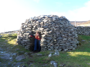 a girl standing in a stone structure