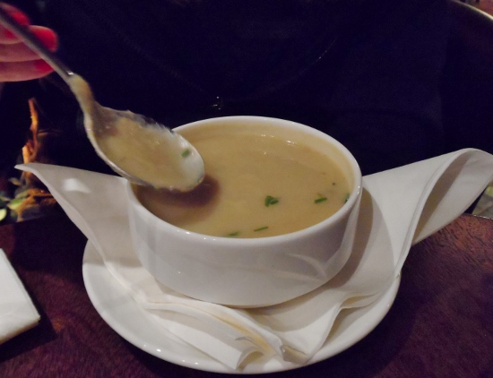 a spoon in a bowl of soup