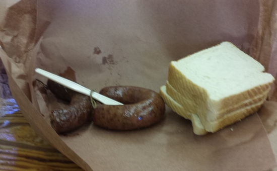 a sausage and a piece of bread