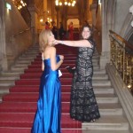 two women in dresses on stairs