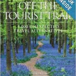a book cover with a path through a forest