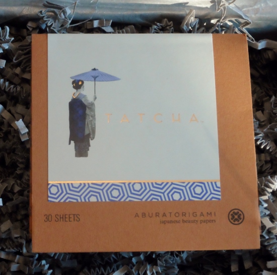 a box with a picture of a woman holding an umbrella