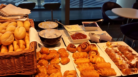 a table full of pastries and desserts