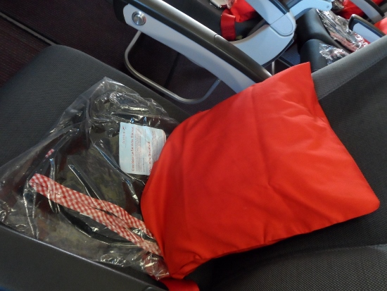 a red pillow on a seat