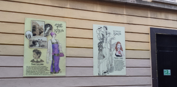 a couple of posters on a wall