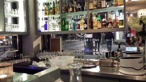 a bar with bottles and glasses