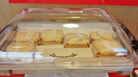 a tray of sandwiches in a glass container