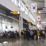 a blurry image of people waiting in a terminal