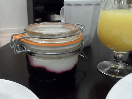 a glass jar with a white and purple liquid in it