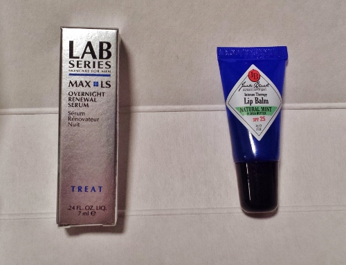 a tube of lip balm next to a tube of lip balm