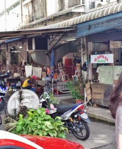 a woman walking past a store