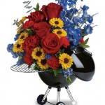 a bouquet of flowers in a barbecue grill