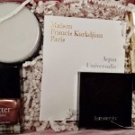 a box of cosmetics and a note