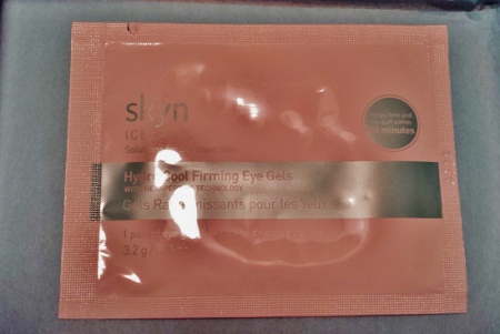 a pink package with a silver label