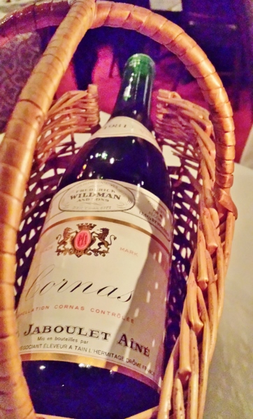 a bottle of wine in a basket