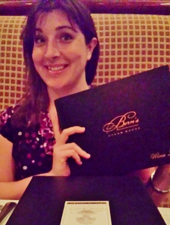 a woman holding a menu